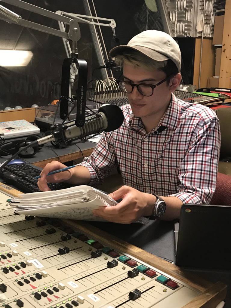 Cameron recording a radio report