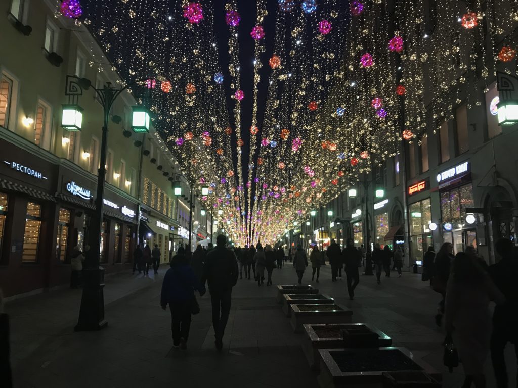 Winter festival lights over a Moscow street.