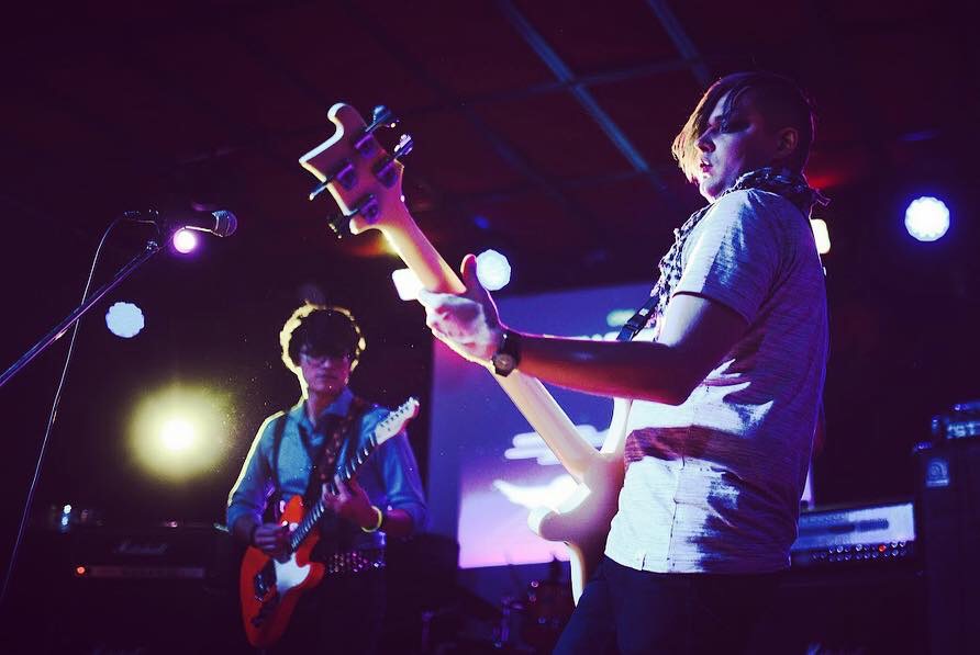 Cameron playing guitar on stage at Mod Club in Saint Petersburg, Russia.