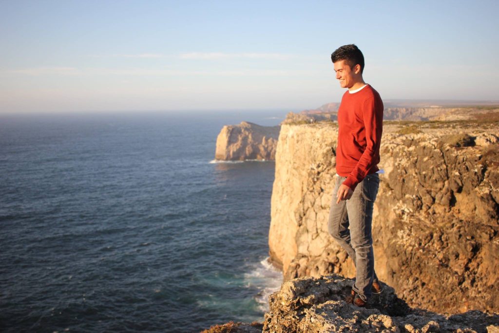Cameron on a cliff in Cape Saint Vincent, Portugal.